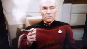 A picture of Patrick Stewart, a star trek character, smoking a cigarette._SCALED