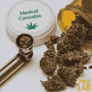 A pill bottle with a labeled "Medical Cannabis" that is partially visible with a dried cannabis buds, and a metal pipe often used for smoking.